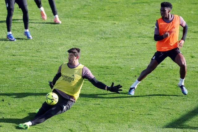 Real Madrid's Belgian goalkeeper #01 Thibaut Courtois (L) and Real Madrid's French midfielder #14 Aurelien Tchouameni attend an open door training session at Real Madrid Sports City in Valdebebas, in the outskirts of Madrid, on December 30, 2025. (Photo by Pierre-Philippe MARCOU / AFP)