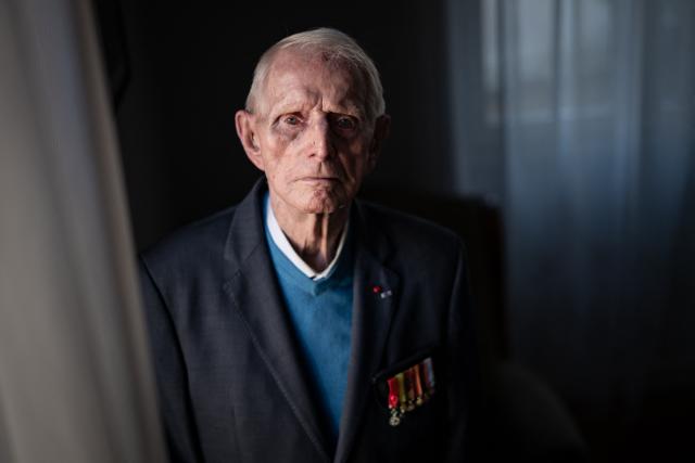 (FILES) French WWII resistance fighter Henri Mosson, who was deported to the Nazi built Natzweiler-Struthof concentration camp and the Dachau camp, poses in Dijon, central eastern France, on October 28, 2024. Henri Mosson, the oldest survivor of the Natzweiler-Struthof camp in Alsace, the only Nazi camp in France, died at the age of 101 on December 29, 2025 in Dijon, his son told AFP. The French resistance fighter, who died a few days before his 102nd birthday on January 5th had been sentenced to death on June 27, 1943 at the age of 19 for obtaining weapons for the Burgundian resistance. (Photo by ARNAUD FINISTRE / AFP)