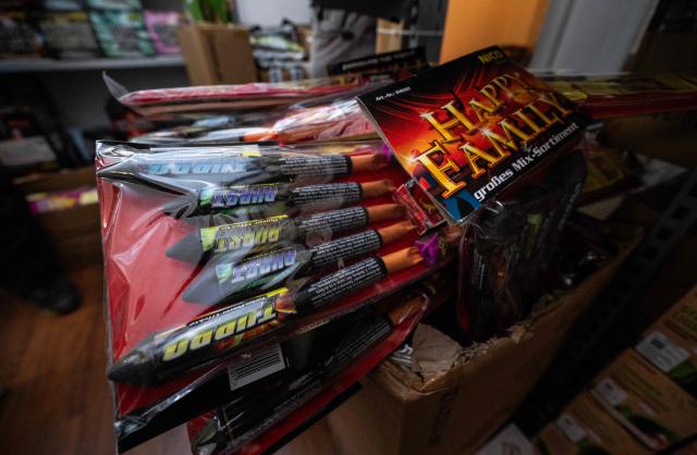 Pyrotechnic devices are stacked in a temporary outlet selling fireworks in Berlin on December 30, 2025, ahead of New Year celebrations in the German capital. (Photo by John MACDOUGALL / AFP)