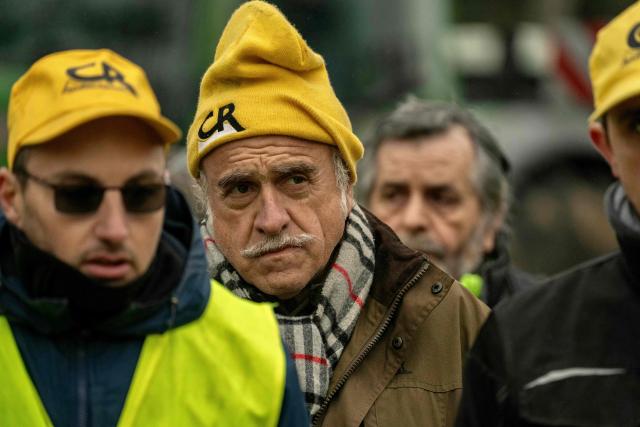 Members of the Confederation Rurale (CR) farmers union gather with other union members before an action to denounce the import of foreign products at a supermarket in Carcassonne, southern France, on December 30, 2025. French farmers have been fuming over a litany of issues, including a trade deal under negotiation between the European Union and South American bloc Mercosur, with any further decisions postponed to January. (Photo by Idriss Bigou-Gilles / AFP)