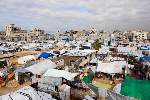 This picture shows shelters in a camp for displaced Palestinians in Gaza City on December 30, 2025. Beginning in October, a fragile ceasefire has so far halted two years of war between Israel and Hamas in the Gaza Strip despite both sides trading accusations of truce violations. (Photo by Omar AL-QATTAA / AFP)