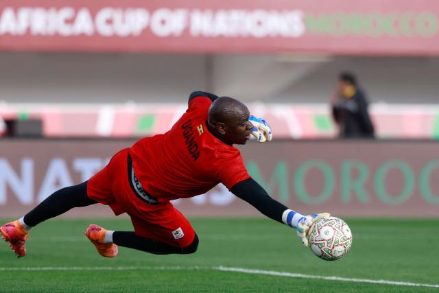Uganda's goalkeeper #18 Denis Onyango warms up before the Africa Cup of Nations (CAN) Group C football match between Uganda and Nigeria at Fez Stadium in Fez on December 30, 2025. (Photo by Abdel Majid BZIOUAT / AFP)