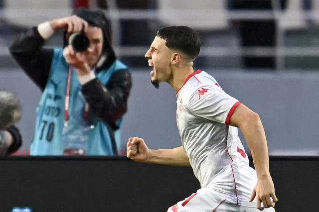 Tunisia's midfielder #11 Ismael Gharbi celebrates his goal during the Africa Cup of Nations (CAN) Group C football match between Tanzania and Tunisia at Rabat Olympic Stadium in Rabat on December 30, 2025. (Photo by Paul ELLIS / AFP)