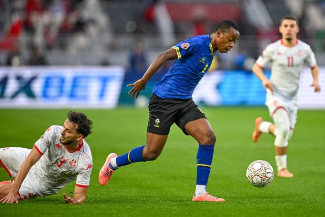 Tanzania's midfielder #06 Feisal Salum outpasses Tunisia's defender #03 Montassar Omar Talbi during the Africa Cup of Nations (CAN) Group C football match between Tanzania and Tunisia at Rabat Olympic Stadium in Rabat on December 30, 2025. (Photo by Paul ELLIS / AFP)
