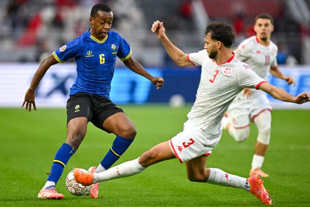 Tanzania's midfielder #06 Feisal Salum and Tunisia's defender #03 Montassar Omar Talbi vie during the Africa Cup of Nations (CAN) Group C football match between Tanzania and Tunisia at Rabat Olympic Stadium in Rabat on December 30, 2025. (Photo by Paul ELLIS / AFP)