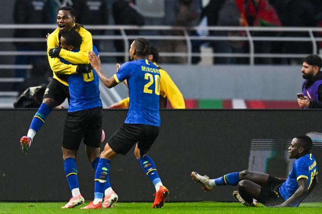 Tanzania's defender #22 Shomari Kapombe celebrates Tanzania's midfielder #06 Feisal Salum's goal during the Africa Cup of Nations (CAN) Group C football match between Tanzania and Tunisia at Rabat Olympic Stadium in Rabat on December 30, 2025. (Photo by Paul ELLIS / AFP)
