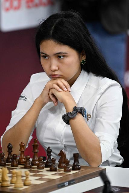 Kazakhstan's Bibisara Assaubayeva plays against Ukraine's Anna Muzychuk (not pictured) in the final round of the FIDE World Rapid and Blitz Championship at Qatar University's Sports and Events Complex in Doha on December 30, 2025. (Photo by Mahmud HAMS / AFP)