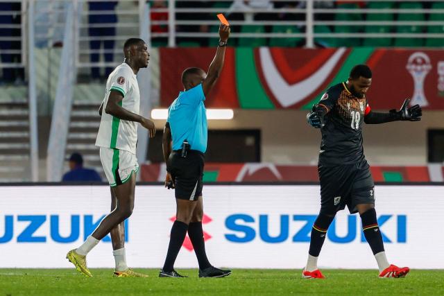 Uganda's goalkeeper #19 Salim Magoola is shown the red card during the Africa Cup of Nations (CAN) Group C football match between Uganda and Nigeria at Fes Stadium in Fes on December 30, 2025. (Photo by Abdel Majid BZIOUAT / AFP)