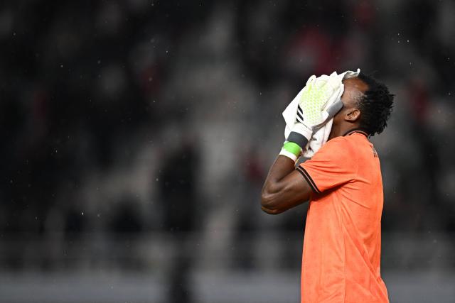 Tanzania's goalkeeper #01 Hussein Masalanga reacts after the Africa Cup of Nations (CAN) Group C football match between Tanzania and Tunisia at Rabat Olympic Stadium in Rabat on December 30, 2025. (Photo by Paul ELLIS / AFP)