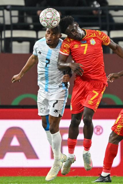 Botswana's forward #7 Kabelo Seakanyeng and Botswana's forward #7 Kabelo Seakanyeng vie during the Africa Cup of Nations (CAN) Group D football match between Botswana and Democratic Republic of Congo at El Madina Stadium in Rabat on December 30, 2025. (Photo by SEBASTIEN BOZON / AFP)