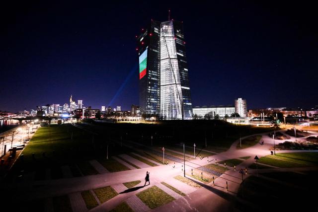 A projection of Bulgaria's national flag is pictured on the facade of the European Central Bank (ECB) headquarters in Frankfurt am Main, western Germany, on December 30, 2025 as a preview of the ECB main building illumination in celebration of Bulgaria’s accession to the euro area. (Photo by Kirill KUDRYAVTSEV / AFP)