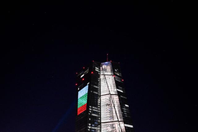 A projection of Bulgaria's national flag is pictured on the facade of the European Central Bank (ECB) headquarters in Frankfurt am Main, western Germany, on December 30, 2025 as a preview of the ECB main building illumination in celebration of Bulgaria’s accession to the euro area. (Photo by Kirill KUDRYAVTSEV / AFP)
