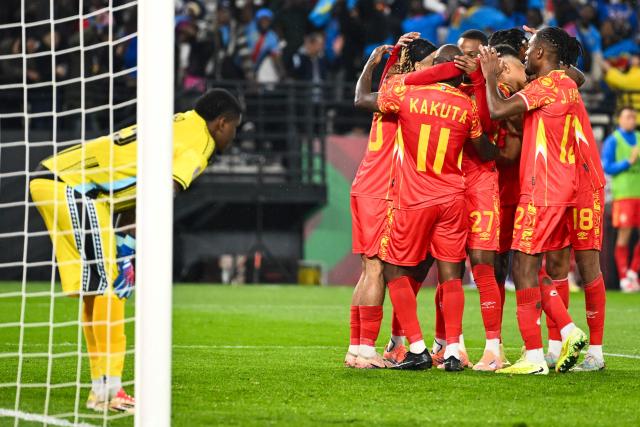 Democratic Republic Of Congo's midfielder #11 Mario Stroeykens is congratulated by teammates after scoring a goal during the Africa Cup of Nations (CAN) Group D football match between Botswana and Democratic Republic of Congo at El Madina Stadium in Rabat on December 30, 2025. (Photo by SEBASTIEN BOZON / AFP)