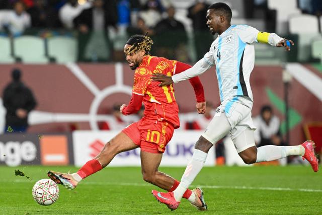Democratic Republic Of Congo's forward #10 Theo Bongonda and Botswana's defender #04 Mosha Gaolaolwe vie during the Africa Cup of Nations (CAN) Group D football match between Botswana and Democratic Republic of Congo at El Madina Stadium in Rabat on December 30, 2025. (Photo by SEBASTIEN BOZON / AFP)