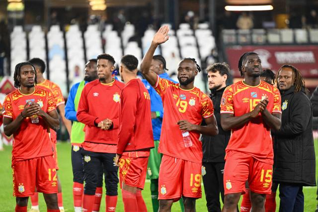 Democratic Republic of Congo players celebrate after the Africa Cup of Nations (CAN) Group D football match between Botswana and Democratic Republic of Congo at El Madina Stadium in Rabat on December 30, 2025. (Photo by SEBASTIEN BOZON / AFP)