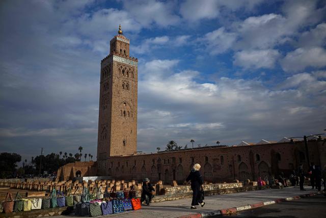 A street vender waits for customers near the Koutoubia Mosque in Marrakesh on December 30, 2025. (Photo by Khaled DESOUKI / AFP)