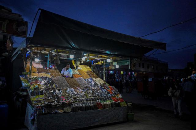 A man sells nuts in the Jemaa el-Fnaa square in Marrakesh on December 30, 2025. (Photo by Khaled DESOUKI / AFP)