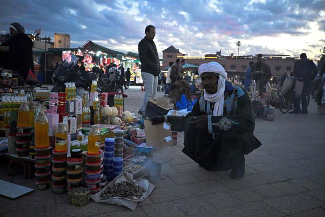 A street vendor sells cosmetics in the Jemaa el-Fnaa square in Marrakesh on December 30, 2025. (Photo by Khaled DESOUKI / AFP)