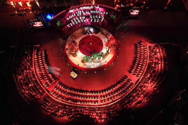 This areal picture shows celebrations during the reopenning ceremony of the National Museum housed at the historic Red Castle (As-Saraya al-Hamra) in the Libyan capital Tripoli on December 12, 2025. In a historic building in central Tripoli, Libyans wander past ancient statues and artefacts, rediscovering a heritage that transcends political divides at their national museum which reopened this month after a 2011 uprising. (Photo by Mahmud Turkia / AFP)