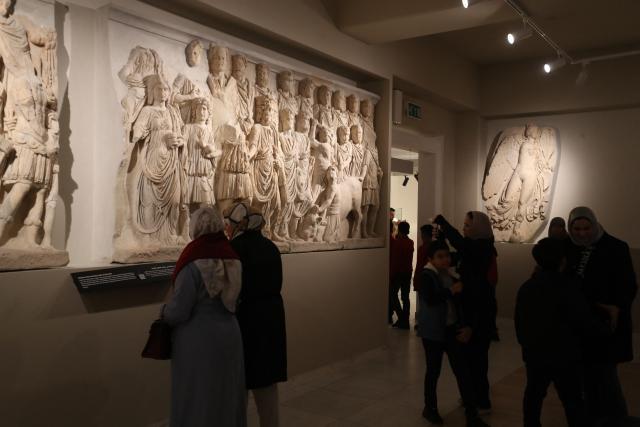 Libyans visit the National Museum after its reopening, following a closure of more than a decade in the Libyan capital Tripoli on December 23, 2025. In a historic building in central Tripoli, Libyans wander past ancient statues and artefacts, rediscovering a heritage that transcends political divides at their national museum which reopened this month after a 2011 uprising. (Photo by Mahmud Turkia / AFP)