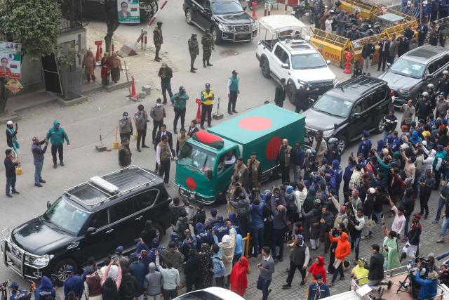 Security personnel escort a convoy carrying Bangladesh's former prime minister Khaleda Zia's mortal remains from Evercare hospital in Dhaka on December 31, 2025. Bangladesh bids farewell on December 31 to former prime minister Khaleda Zia with a state funeral expected to draw vast crowds, mourning a towering leader whose career defined politics for decades. (Photo by Joyeeta ROY / AFP)