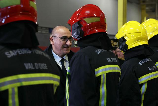 France's Interior Minister Laurent Nunez meets French firefighters at the Department Fire and Rescue Service (Service Départemental d'Incendie et de Secours - SDIS) ahead of New Year's Eve, in Villiers-le-Bel, a suburb of Paris, on December 31, 2025. (Photo by Alain JOCARD / POOL / AFP)