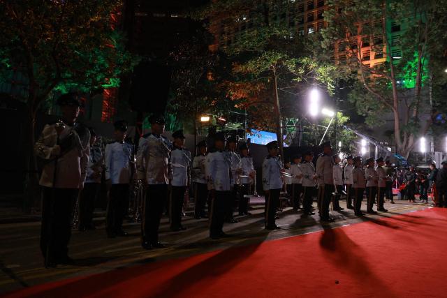 A band performs during Hong Kong's New Year’s countdown celebrations in Central, Hong Kong, on December 31, 2025. (Photo by May JAMES / AFP)
