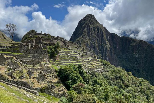 (FILES) General view of the ancient Inca citadel of Machu Picchu in the Urubamba valley, near the Andean city of Cusco, taken on April 21, 2023. Rail service to Machu Picchu, Peru's main tourist attraction, resumed on December 31, 2025, a day after a head-on collision between two trains on that tourist route left one person dead and 40 injured, the operating companies reported. (Photo by Mariana SUAREZ / AFP)