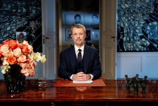 King Frederik X of Denmark looks on after delivering his New Year's speech from Frederik VIII's Palace, Amalienborg Castle, in Copenhagen on December 31, 2025. (Photo by Mads Claus Rasmussen / Ritzau Scanpix / AFP) / Denmark OUT