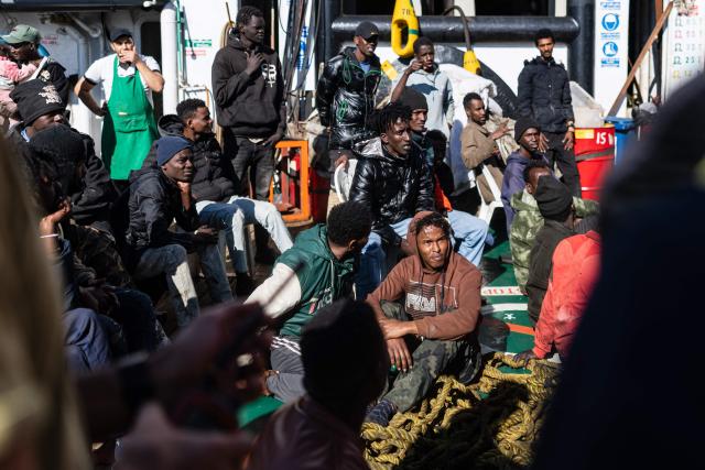 Migrants listen to instructions from crew members of the “Ocean Viking” rescue ship as they prepare to board a RHIB (Rigid inflatable boat) from the oil tanker the Maridive 703, in the search-and-rescue zone in international waters between Malta and Tunisia, on December 31, 2025. 33 migrants were rescued by crew members of the migrants rescue ship "Ocean Viking" operated by the French NGO SOS Mediterranee. They had been stranded on the oil tanker the Maridive 703 since their initial rescue 5 days ago in the joint search zone between Malta and Tunisia in international Mediterranean waters. (Photo by Sameer Al-DOUMY / AFP)