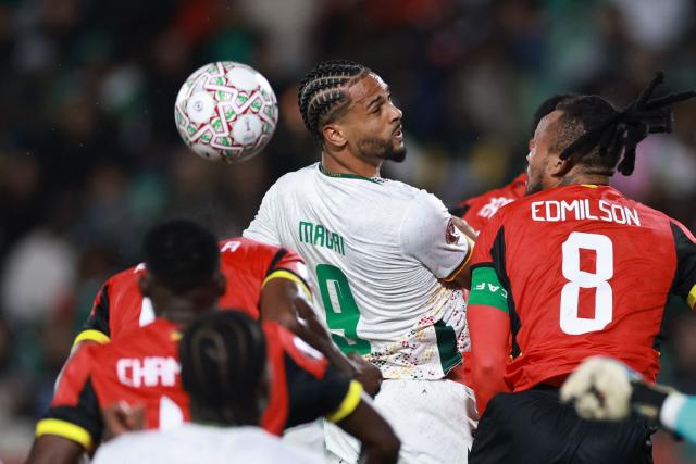 Cameroon's forward #09 Frank Magri (C) fights for the ball with Mozambique's defender #08 Edmilson Dove (R) during the Africa Cup of Nations (CAN) Group F football match between Mozambique and Cameroon at the Grand Stadium in Agadir on December 31, 2025. (Photo by FRANCK FIFE / AFP)