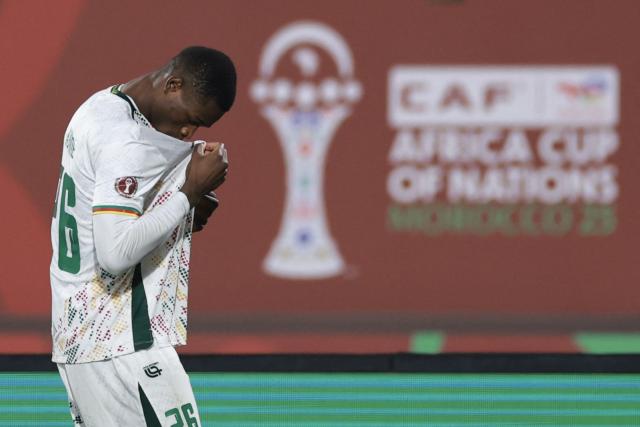 Cameroon's forward #26 Christian Kofane kisses his jersey to celebrate scoring his team's second goal during the Africa Cup of Nations (CAN) Group F football match between Mozambique and Cameroon at the Grand Stadium in Agadir on December 31, 2025. (Photo by FRANCK FIFE / AFP)
