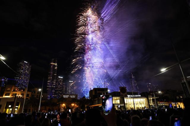 Fireworks light up the sky around the Burj Khalifa Tower, as the UAE welcomes in the New Year, in Dubai on January 1, 2026. (Photo by Fadel SENNA / AFP)