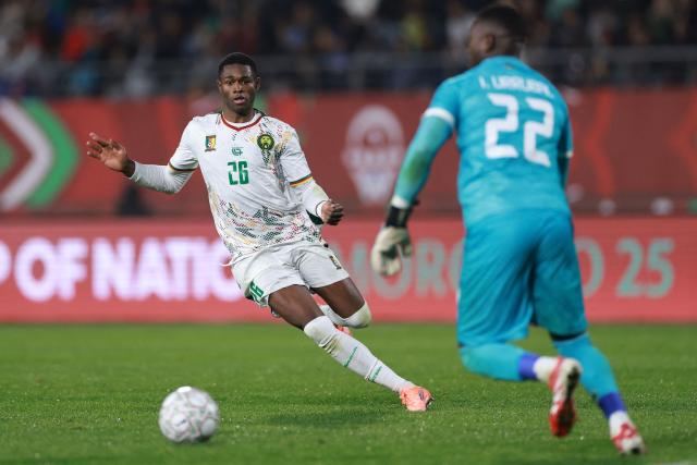 Cameroon's forward #26 Christian Kofane looks at the ball during the Africa Cup of Nations (CAN) Group F football match between Mozambique and Cameroon at the Grand Stadium in Agadir on December 31, 2025. (Photo by FRANCK FIFE / AFP)