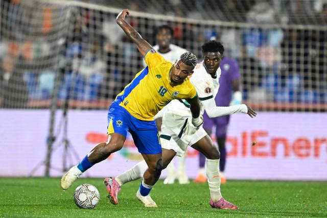 Gabon's midfielder #18 Mario Lemina fights for the ball with Ivory Coast's midfielder #19 Christ Inao Oulai during the Africa Cup of Nations (CAN) Group F football match between Gabon and Ivory Coast at the Grand Stadium in Marrakech on December 31, 2025. (Photo by Khaled DESOUKI / AFP)