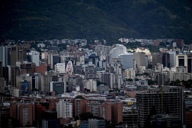 A view of the city of Caracas, taken on December 31, 2025. The United States announced sanctions on four companies Wednesday over their operations in Venezuela's oil sector, in the latest effort to put pressure on the nation's President Nicolas Maduro. (Photo by Juan BARRETO / AFP)