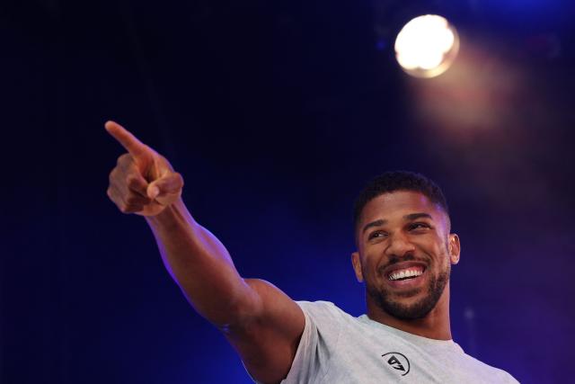 (FILES) Britain's Anthony Joshua gestures as he arrives on stage for a public weigh-in in Trafalgar Square on September 20, 2024 on the eve of a heavyweight boxing match for the IBF world title in London. Former world heavyweight boxing champion Anthony Joshua has been discharged from hospital days after a fatal car accident that killed two of his close friends in Nigeria.
"Anthony Joshua was discharged from hospital late this afternoon though heavy hearted and full of emotions over the loss of his two close friends he was deemed clinical fit to recuperate from home," spokesmen for Ogun and Lagos states in southwest Nigeria said in a joint statement late on December 31, 2025. (Photo by Adrian Dennis / AFP)