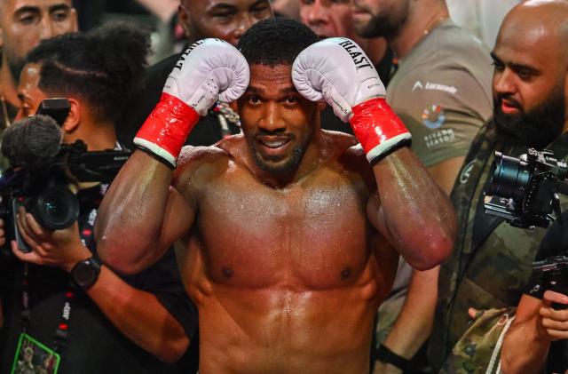 (FILES) British boxer Anthony Joshua celebrates after defeating US boxer and influencer Jake Paul (off frame) in a non-title heavyweight bout at the Kaseya Center in Miami, Florida, on December 19, 2025. Former world heavyweight boxing champion Anthony Joshua has been discharged from hospital days after a fatal car accident that killed two of his close friends in Nigeria.
"Anthony Joshua was discharged from hospital late this afternoon though heavy hearted and full of emotions over the loss of his two close friends he was deemed clinical fit to recuperate from home," spokesmen for Ogun and Lagos states in southwest Nigeria said in a joint statement late on December 31, 2025. (Photo by Giorgio VIERA / AFP)
