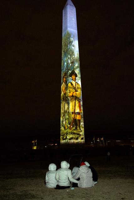 The Washington Monument is illuminated with a projection of US President Donald Trump's "Freedom 250" initiative during the New Year's Eve show at the National Mall in Washington, DC on December 31, 2025. The Washington Monument is illuminated to start the beginning of a momentous year for the US, as it marks 250 years since the Declaration of Independence was signed. (Photo by Amid FARAHI / AFP)