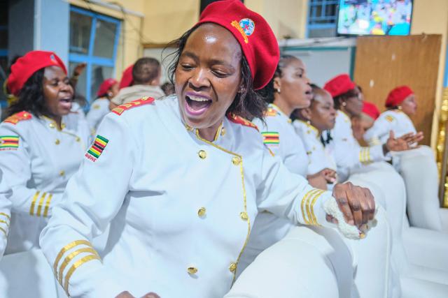 Women sing praise songs moments after midnight during a crossover service at the SPIF Synagogue in Bulawayo on January 1, 2026. (Photo by Zinyange Auntony / AFP)