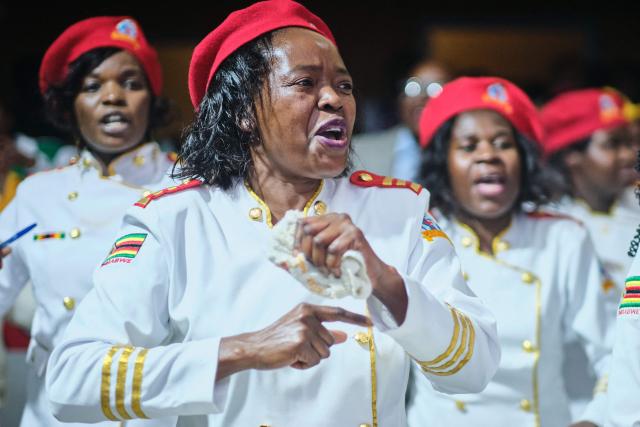 Women sing praise songs moments after midnight during a crossover service at the SPIF Synagogue in Bulawayo on January 1, 2026. (Photo by Zinyange Auntony / AFP)