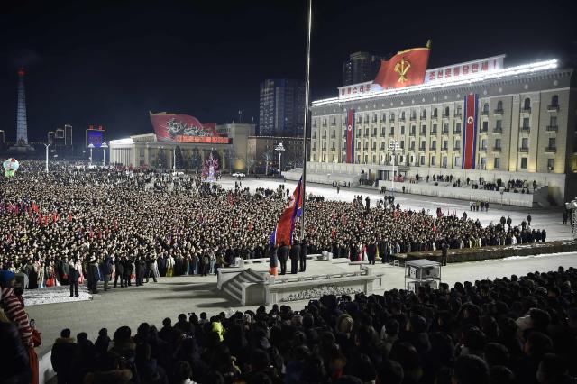 This picture shows a flag-raising ceremony to welcome in the new year at Kim Il Sung Square in Pyongyang on January 1, 2026. (Photo by KIM Won Jin / AFP)