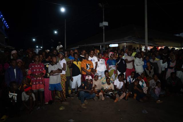 A crowd watches a performance during the Sierra Leone New Year's Cultural Festival in Kabala on January 1, 2026. (Photo by Gemma Bonfiglioli / AFP)