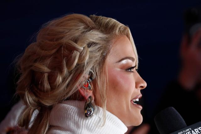 British singer and actress Rita Ora speaks as revelers gather to celebrate New Year's Eve in Times Square on December 31, 2025 in New York. (Photo by John Lamparski / AFP)