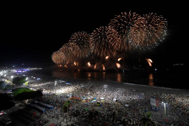 Fireworks to celebrate the New Year explode on Copacabana Beach during celebrations in Rio de Janeiro, Brazil, on January 1, 2026. Rio de Janeiro received, on December 30, 2025, the title of the world’s largest New Year’s Eve celebration from the Guinness World Records, a recognition of its famous massive festivity with live music shows by the sea. (Photo by Daniel RAMALHO / AFP)