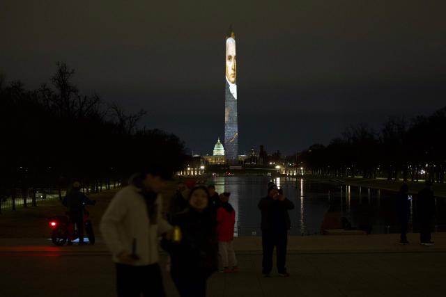 The Washington Monument is illuminated with a projection of US President Donald Trump's "Freedom 250" initiative during the New Year's Eve show at the National Mall in Washington, DC on December 31, 2025. The Washington Monument is illuminated to start the beginning of a momentous year for the US, as it marks 250 years since the Declaration of Independence was signed. (Photo by Amid FARAHI / AFP)