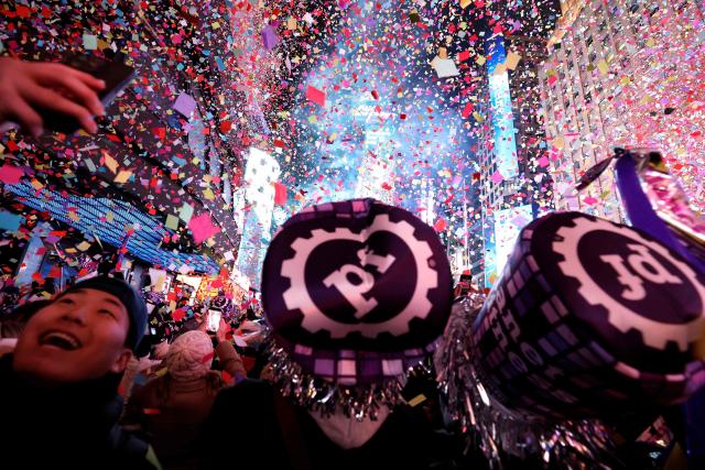 Confetti falls during the New Year's Eve celebrations and ball drop in Times Square in New York on January 1, 2026. (Photo by John Lamparski / AFP)