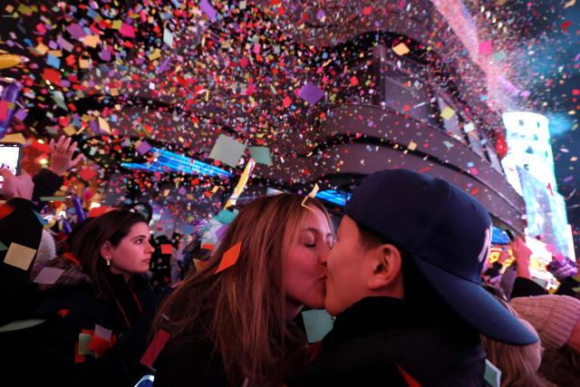 A couple kiss during the New Year's Eve celebrations and ball drop in Times Square in New York on January 1, 2026. (Photo by John Lamparski / AFP)