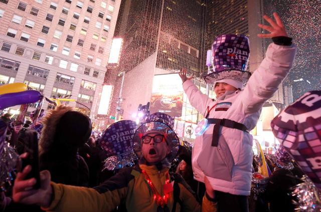 People attend the New Year's Eve celebrations and ball drop in Times Square in New York on January 1, 2026. (Photo by John Lamparski / AFP)
