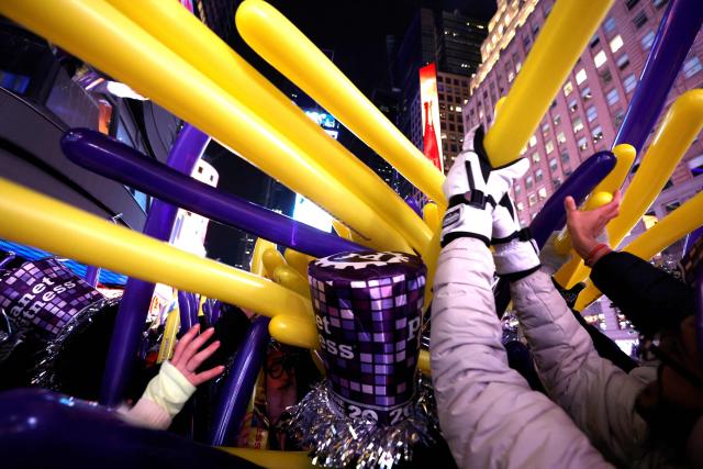 People attend the New Year's Eve celebrations and ball drop in Times Square in New York on January 1, 2026. (Photo by John Lamparski / AFP)